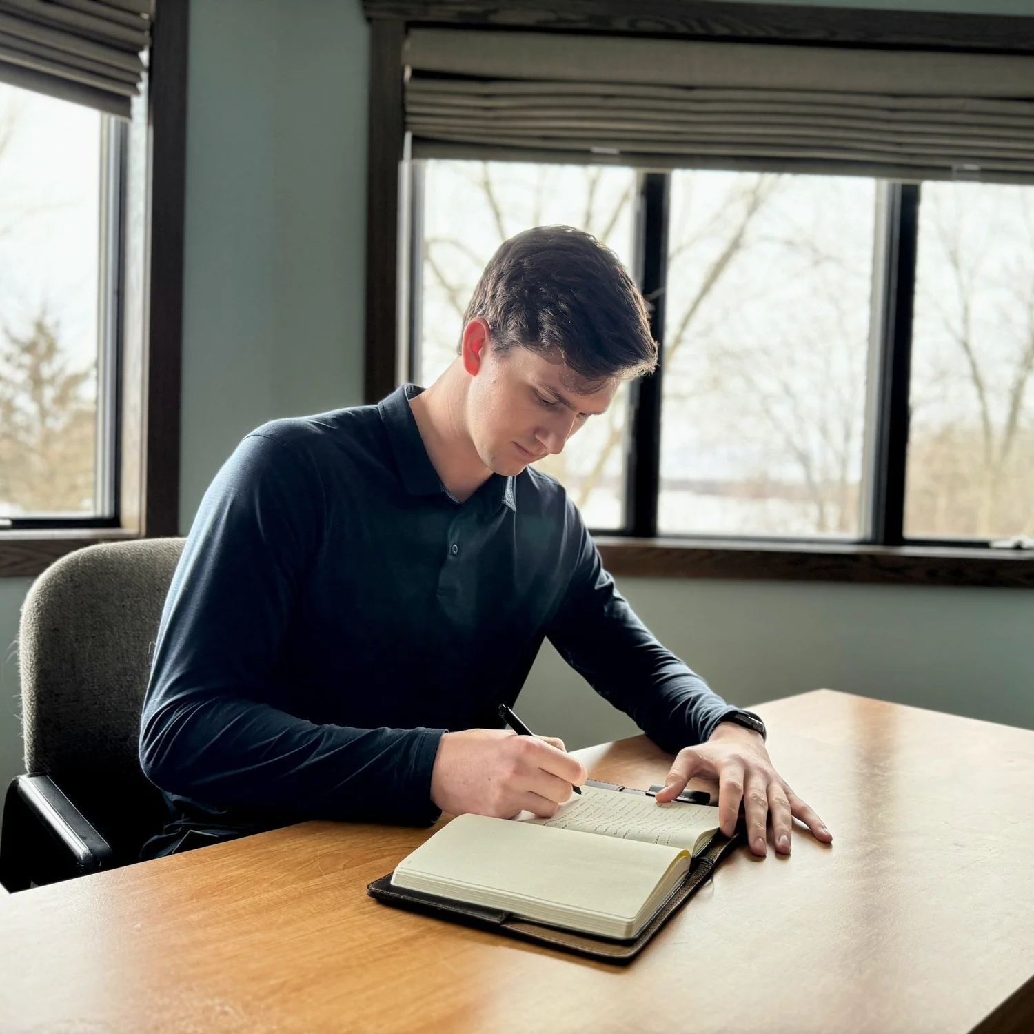 Kevin writing and studying